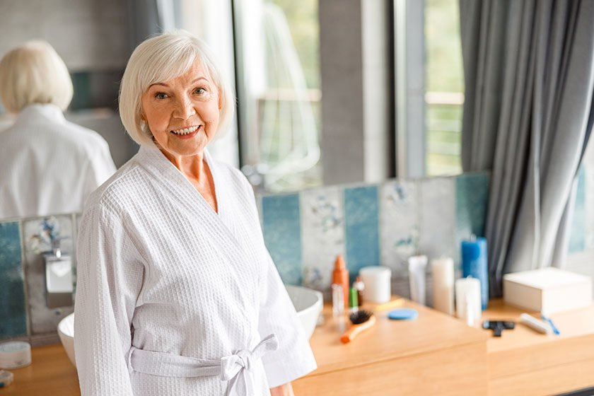 Joyful old woman spending time in spa salon